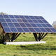 Solar panels installed on a metal built structure in a field - PhotoDune Item for Sale