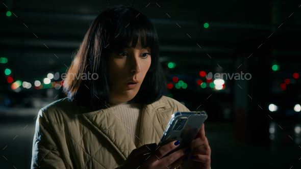 Female character looking at a phone screen with emotional expression