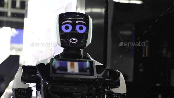 Futuristic robot with electronic face. Media. Funny talking robot with cute facial expression