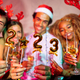 Friends holding little balloons shaped as numbers 2023 at New Year party midnight countdown - PhotoDune Item for Sale