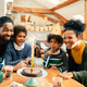 Cheerful African American family celebrating girl&#39;s Birthday and having fun at home. - PhotoDune Item for Sale