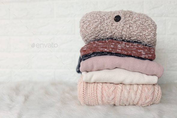 Winter fashion, stack of folded knitted warm wear