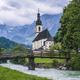 A wood bench with parish church, river abd mountains in background. berchtesgaden, Ramsau Germany - PhotoDune Item for Sale