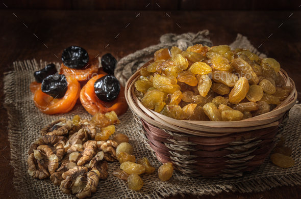 raisins in a basket and other dried fruits - Stock Photo - Images