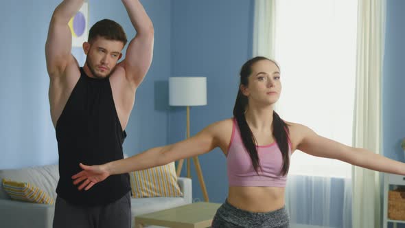 Man and Woman Get Ready To Practice Morning Yoga alt