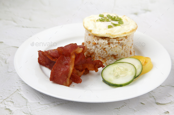 Freshly cooked Filipino food called Bacon Silog or fried bacon, egg and ...