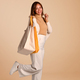 Full length of beautiful woman in warm sweater holding shopping bags. - PhotoDune Item for Sale
