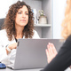 Doctor listens to one of her patients in the office - PhotoDune Item for Sale