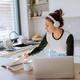 Young woman having homeoffice in her kitchen. - PhotoDune Item for Sale