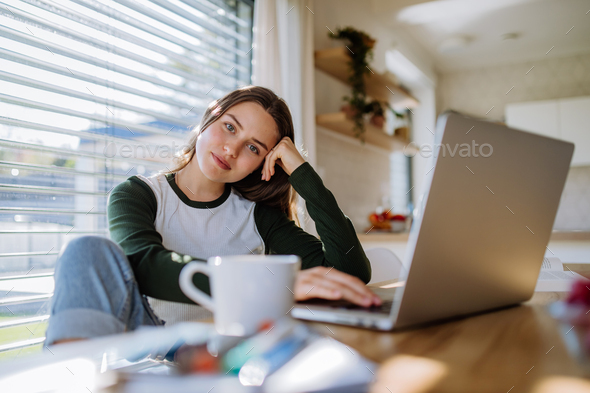 Portrait of bored woman with laptop, homeoffice concept. - Stock Photo - Images