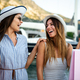 Two beautiful young women enjoying shopping and travel in the city. - PhotoDune Item for Sale
