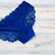 Top view women&#39;s underwear panties on a wooden background. - PhotoDune Item for Sale