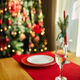 Beautiful table setting with Christmas decorations in living room - PhotoDune Item for Sale