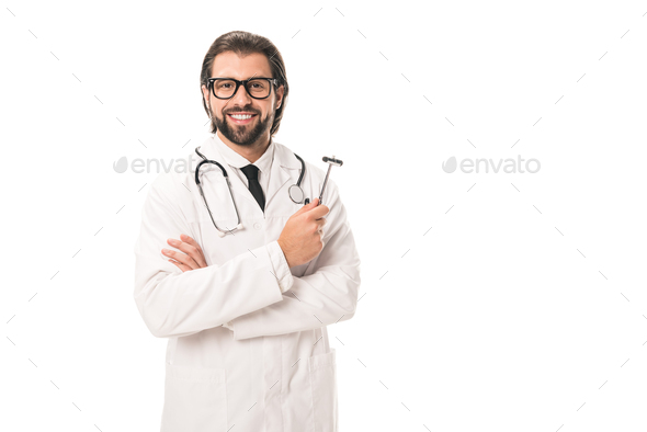 handsome bearded doctor in white coat and eyeglasses holding reflex hammer and smiling at camera