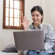 Friendly woman waving her hand in online meeting - PhotoDune Item for Sale