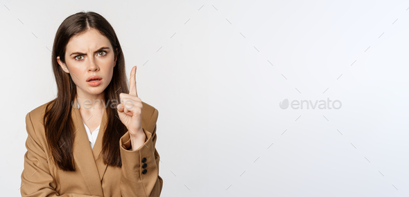 Angry corporate woman, boss shaking finger disapproval, scolding someone, prohibit something