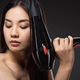 portrait of asian woman with hair dryer isolated on black - PhotoDune Item for Sale