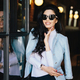 Portrait of glamour young woman with dark wavy hair wearing sunglasses and white blouse - PhotoDune Item for Sale