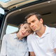 sad adult couple sitting in car together and looking away - PhotoDune Item for Sale