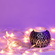 Beautiful burning candle and garlands with neon lighting. - PhotoDune Item for Sale