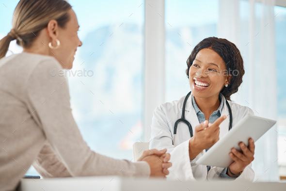 Doctor with patient and tablet showing lab results, good news for health insurance or medical cure
