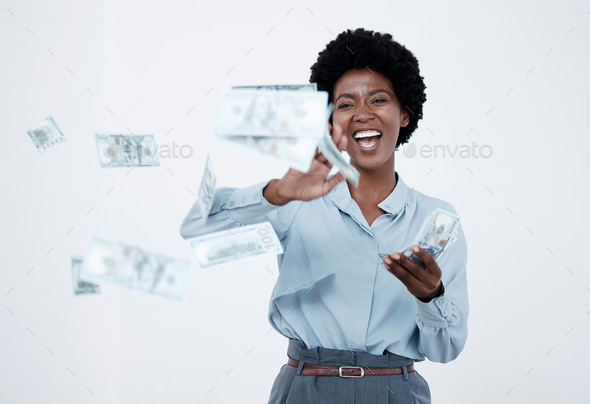 Cheerful business woman throwing money bills. Woman throwing banknotes to celebrate victory of busi