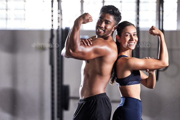 Fitness, flexing muscles and strong couple goals while doing exercise or training in a gym. Portrai