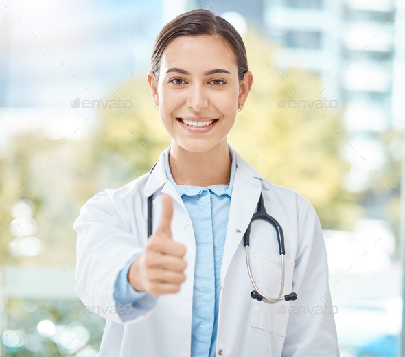 Yes, doctor success and thank you thumbs up of a woman with a winner, happy and support hand sign.