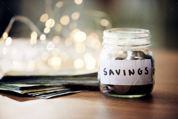 Savings jar, money notes and change of saving for bank investment, retirement and financial safety.