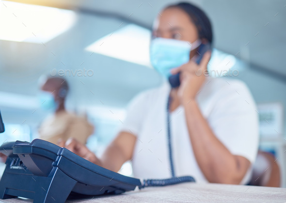 Business woman or receptionist on telephone call with a mask for covid, corona or virus safety. Com