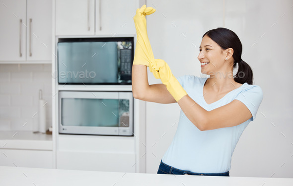 Cleaning, safety and sanitizing with a woman cleaner in rubber gloves ready to do chores and house