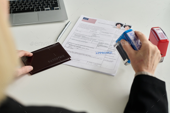 Immigration office worker approving visa