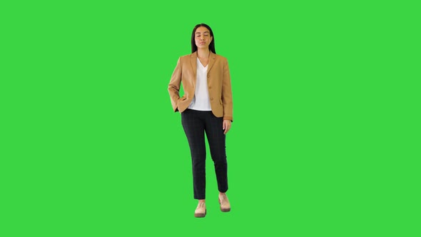 Young Indian Girl Stand Smiling Making v Sign on a Green Screen Chroma Key