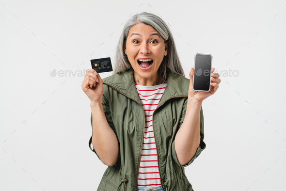 Crying shouting happy as a winner caucasian mature middle-aged woman