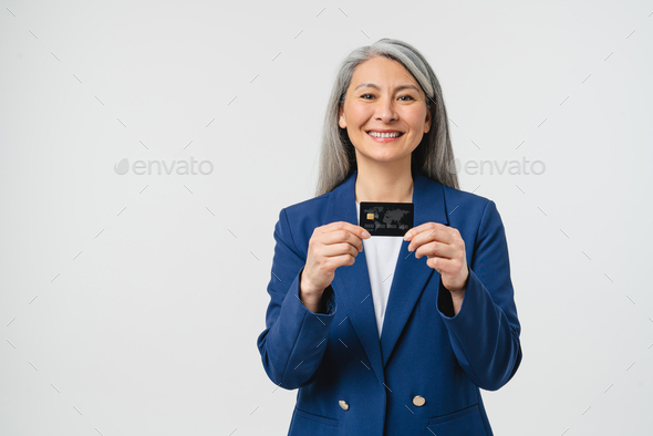 Successful mature middle-aged bank employee manager businesswoman - Stock Photo - Images
