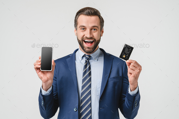 Extremely happy shocked surprised impressed caucasian young businessman - Stock Photo - Images