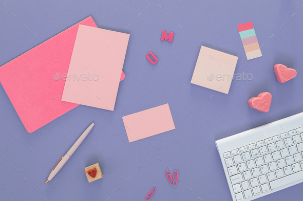 Office desk with blank paper sheets, heart-shaped candies. Valentine's day concept. - Stock Photo - Images