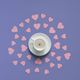 White cup with small red heart-shaped candy on the bottom. - PhotoDune Item for Sale