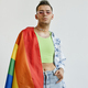 Young gay man draped with pride flag - PhotoDune Item for Sale