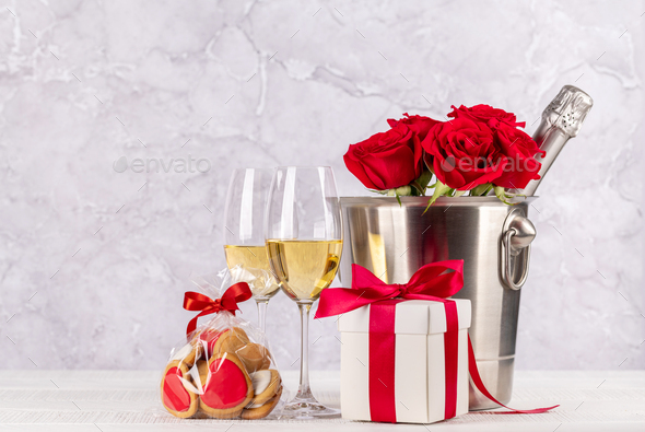 Valentines day card with champagne, rose flowers and gift box - Stock Photo - Images