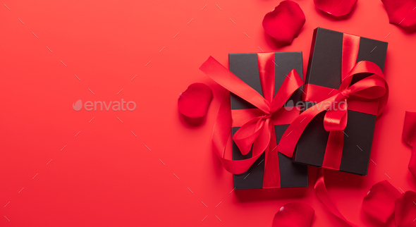 Valentines day card with gift boxes and rose petals - Stock Photo - Images
