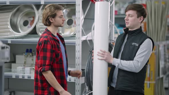 Middle Shot of Concentrated Caucasian Man Receiving Plastic Construction Film From Salesman  alt