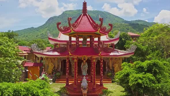 Drone View Old Pagoda Entrance Against Hills Blue Sky alt