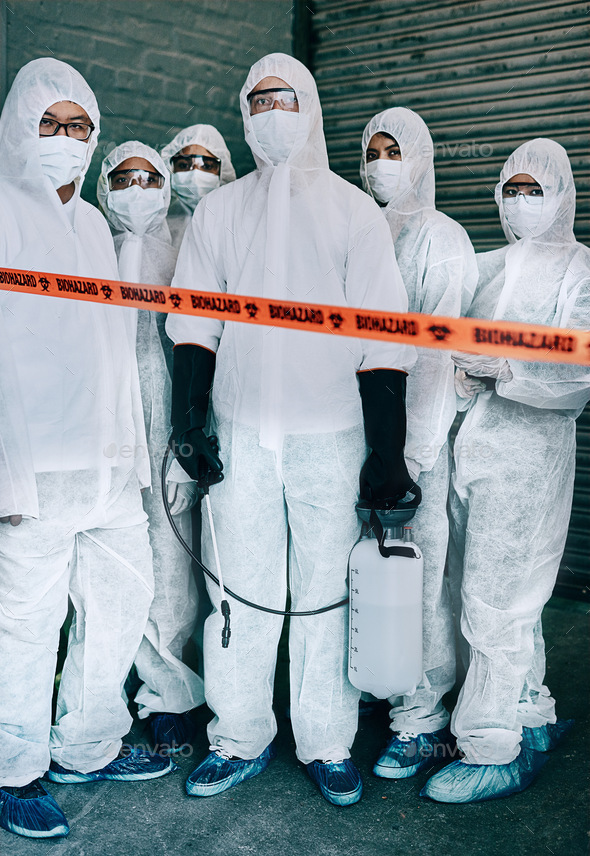 Shot of a group of healthcare workers wearing hazmat suits working together to control an outbreak