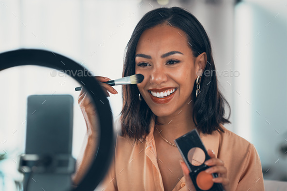 Beauty influencer, vlogger or podcast host teaching with a phone to film live stream makeup tutoria