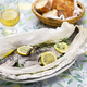 Orata al cartoccio; black sea bream wrapped in paper and baked, Italian cuisine - PhotoDune Item for Sale