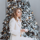 happy businesswoman with cup of coffee with decorated Christmas tree - PhotoDune Item for Sale