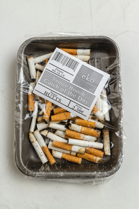 Top view plastic wrapped pile of used cigarettes. - Stock Photo - Images