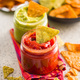 Red and green salsa with tortilla chips on kitchen table. - PhotoDune Item for Sale