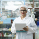 Female pharmacist checking stock inventory in pharmacy. - PhotoDune Item for Sale
